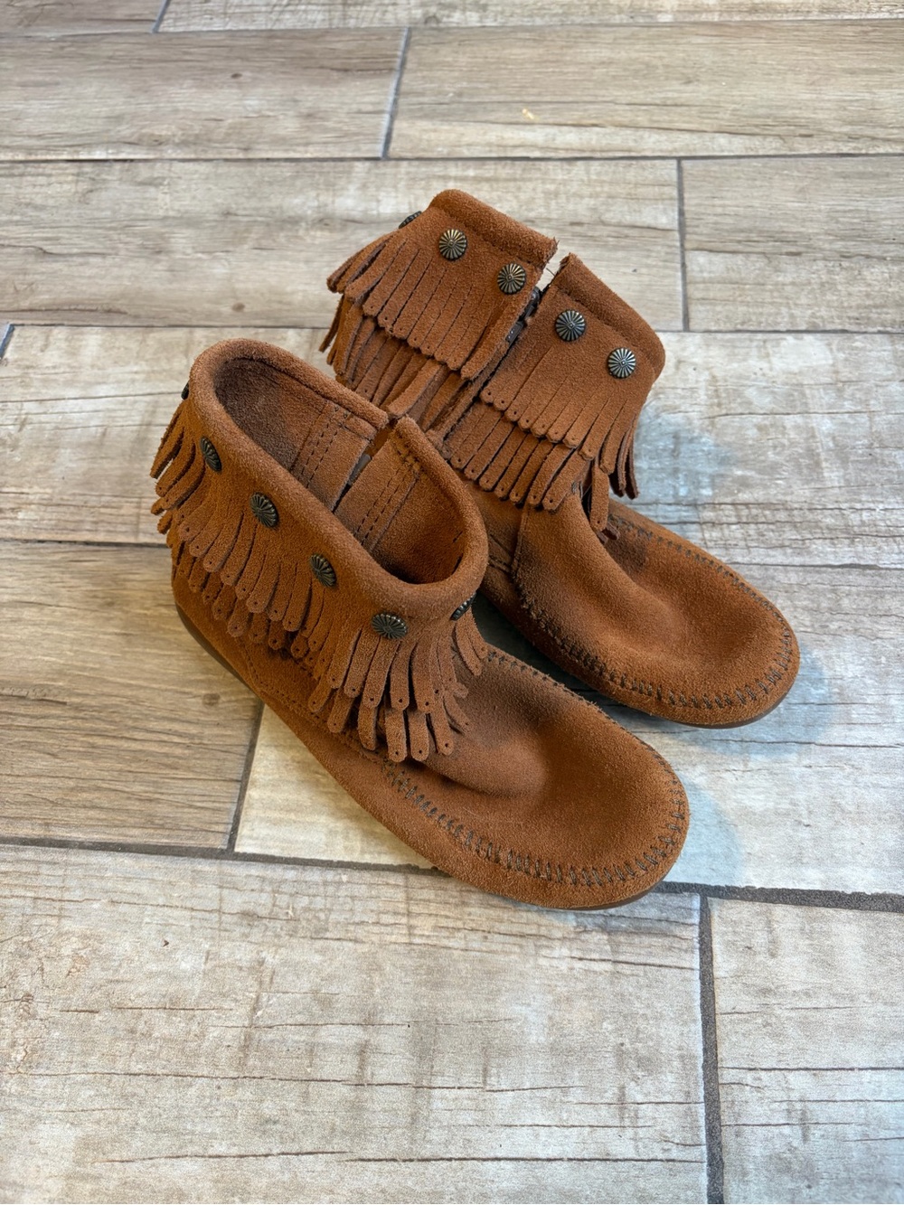 Minnetonka Chestnut Fringe Moccasins with Concho Studs